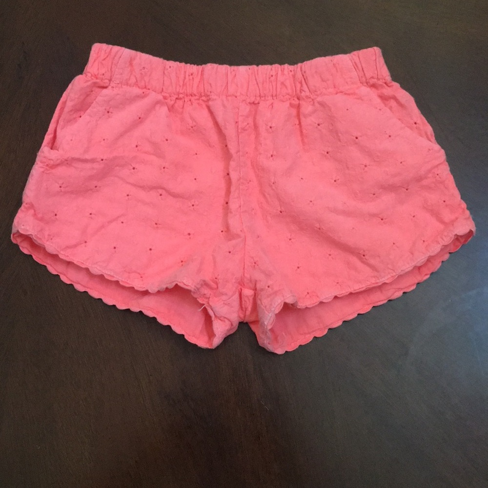 Eyelet shorts in bright coral by Peek.